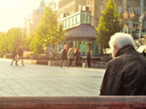 A veteran sitting on a bench outdoors