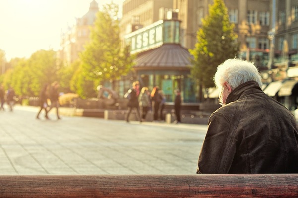 A veteran sitting on a bench outdoors