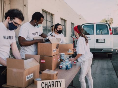 Volunteers handing out aid at a nonprofit event