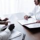 A social worker meeting clients