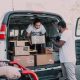 An NGO’s volunteers unloading boxes of food and medicine from a truck