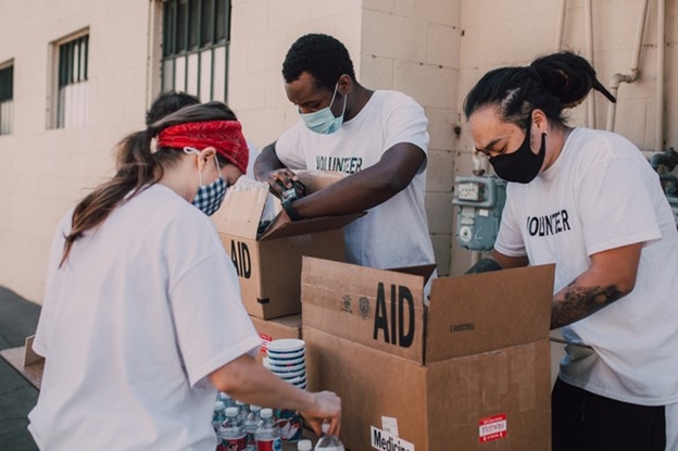 NGO volunteers distributing food and medicines