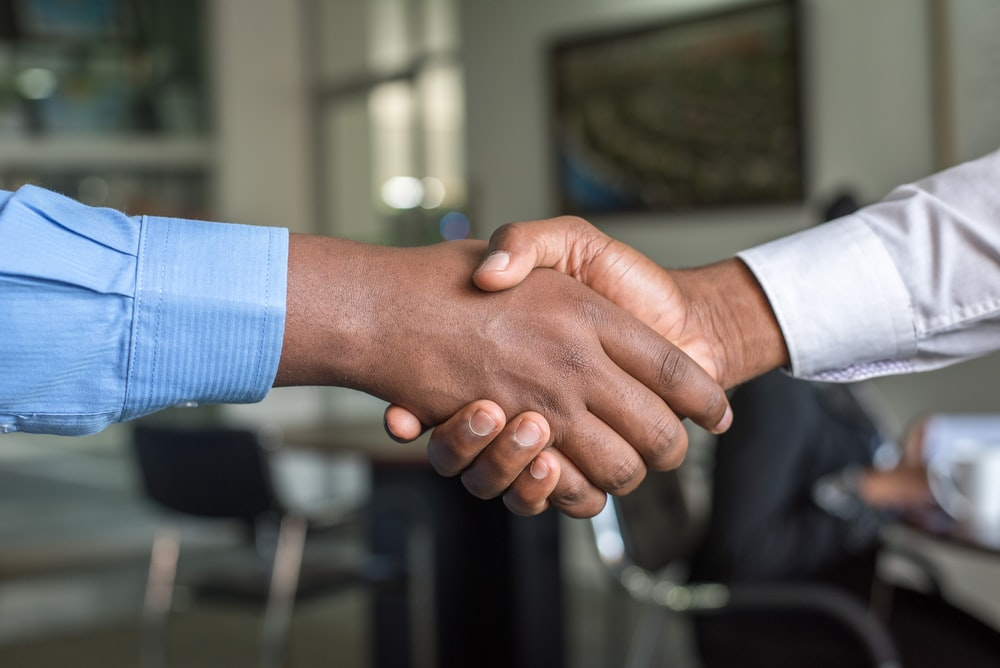 Two businesspeople shaking hands