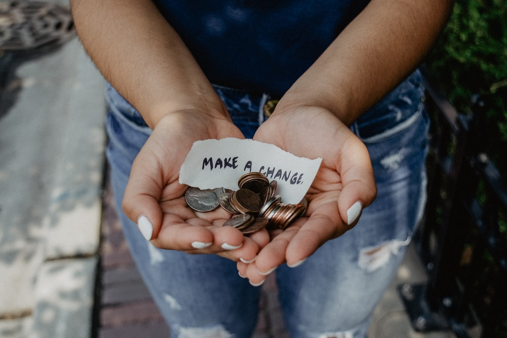 A girl holding coins