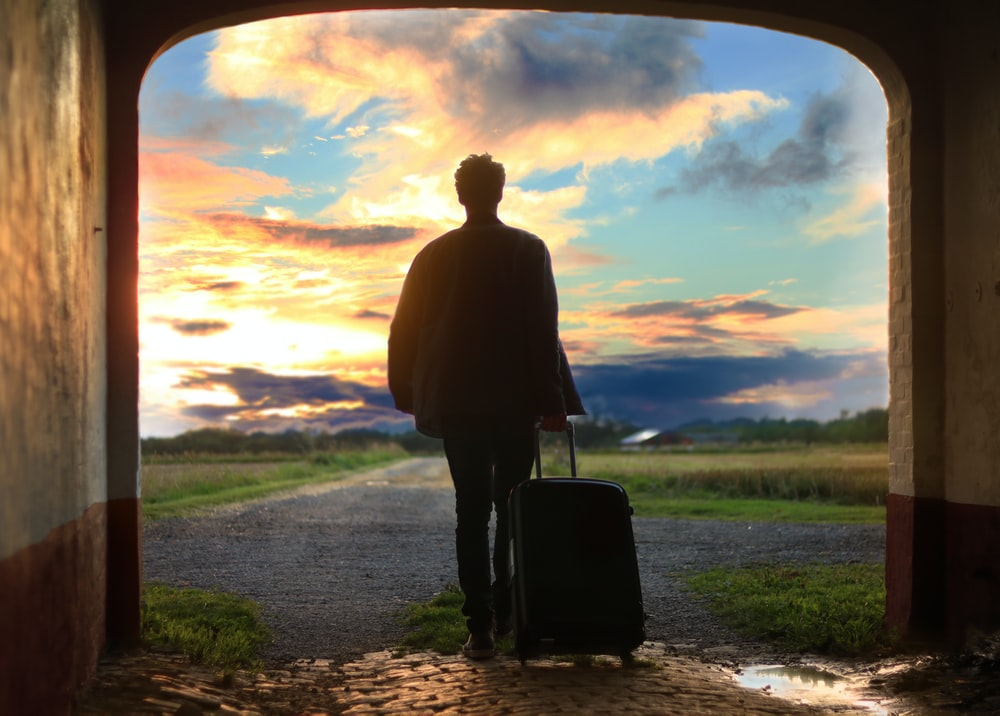 A person holding a luggage