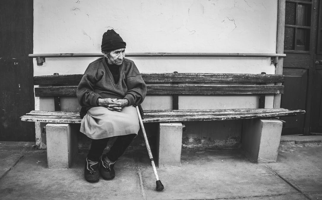 Older woman sitting on a bench