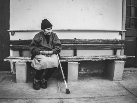 Older woman sitting on a bench