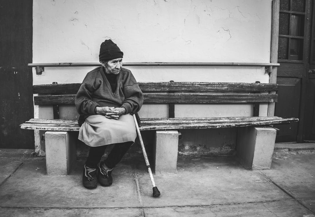 Older woman sitting on a bench