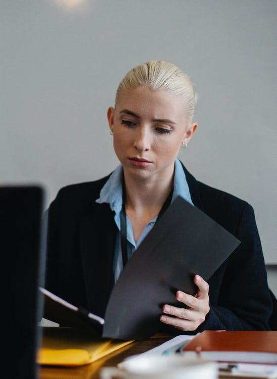 woman checking out case files